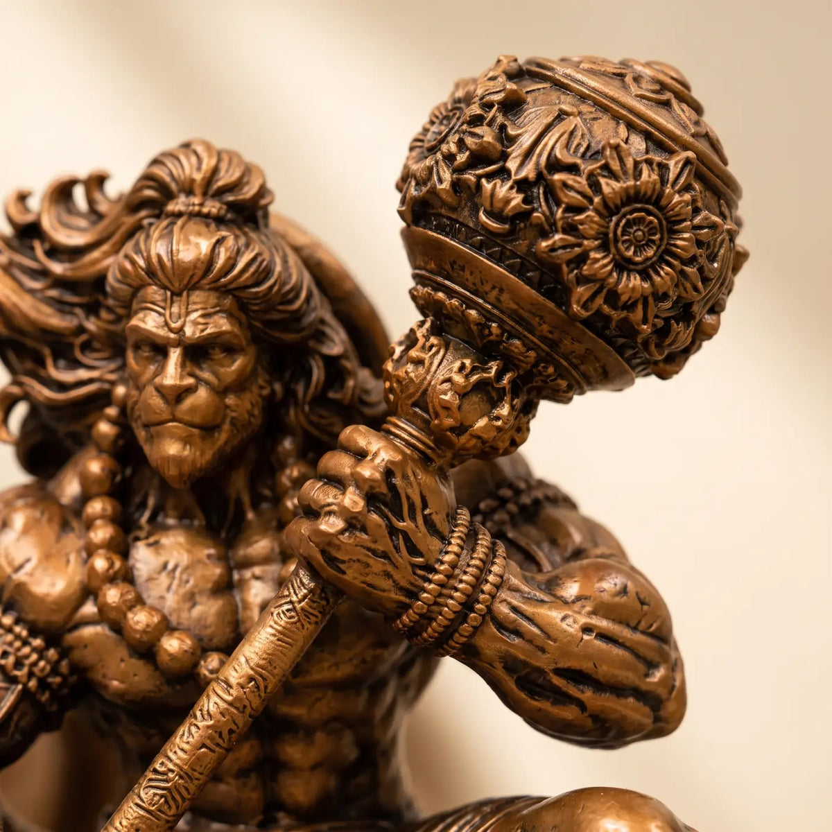 Close-up of Mahabali Hanuman's face and carved gada