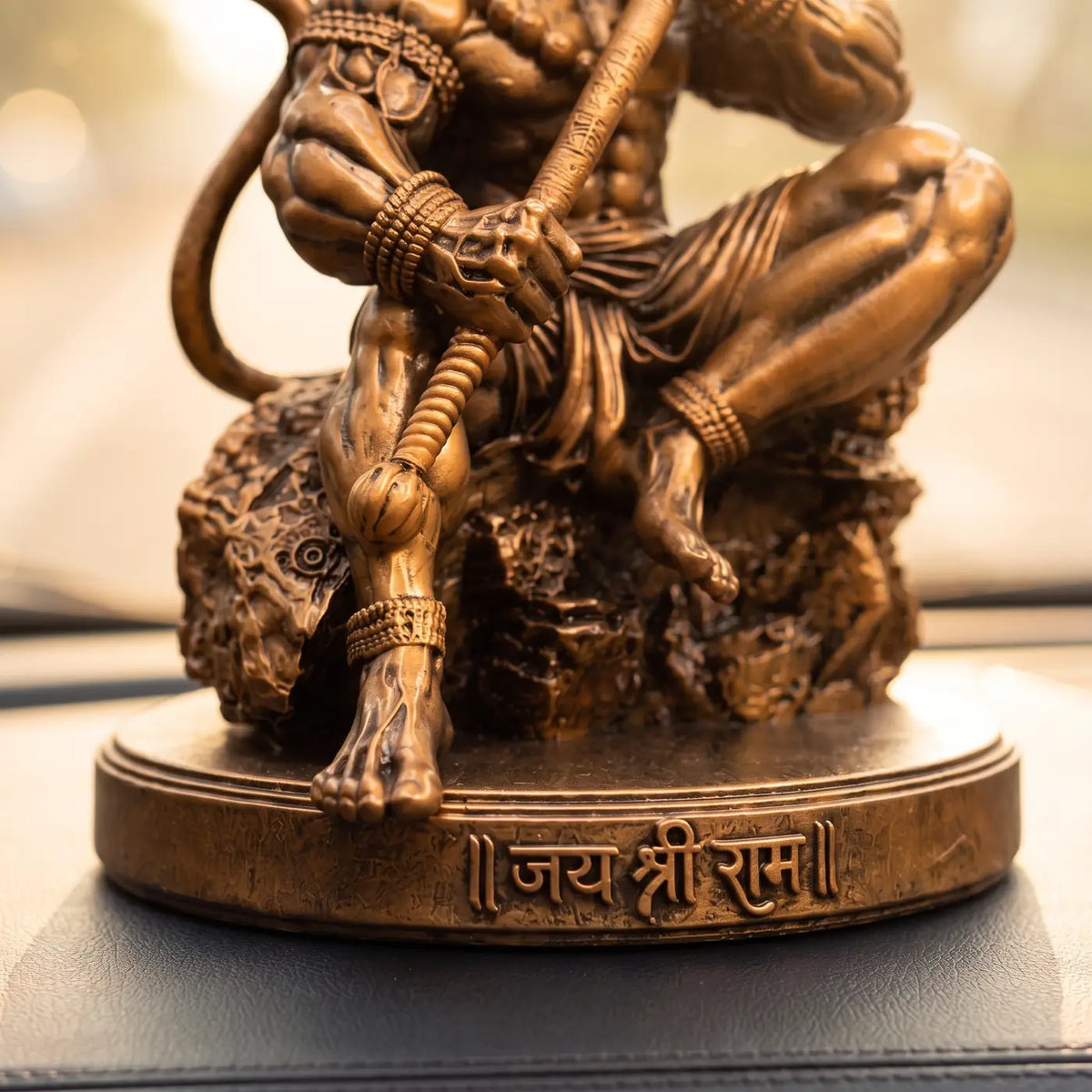 Close-up of the Jai Shree Ram engraving on the Hanuman idol's base