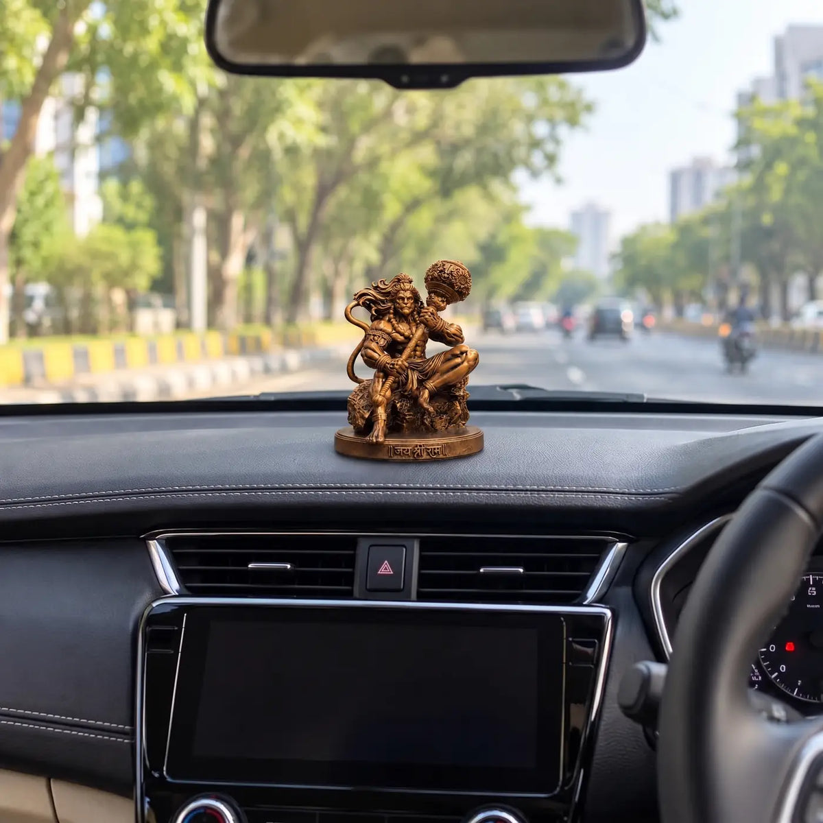 Mahabali Hanuman car dashboard idol seen from the driver's seat
