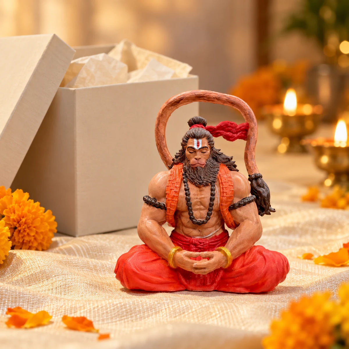 Ram Bhakt Hanuman Ji idol as a gift, beside a gift box and diyas