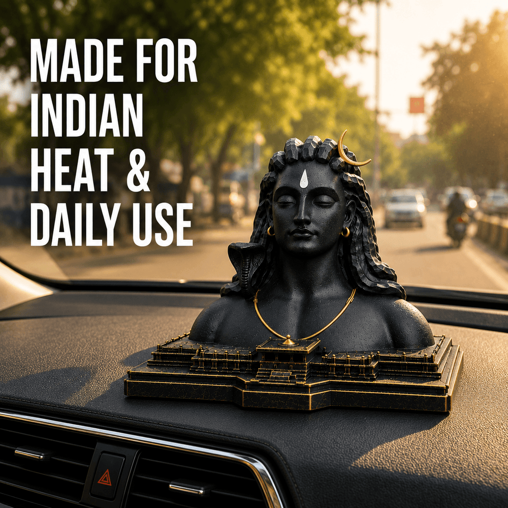 The Aadiyogi bust on a dashboard on a sunny road