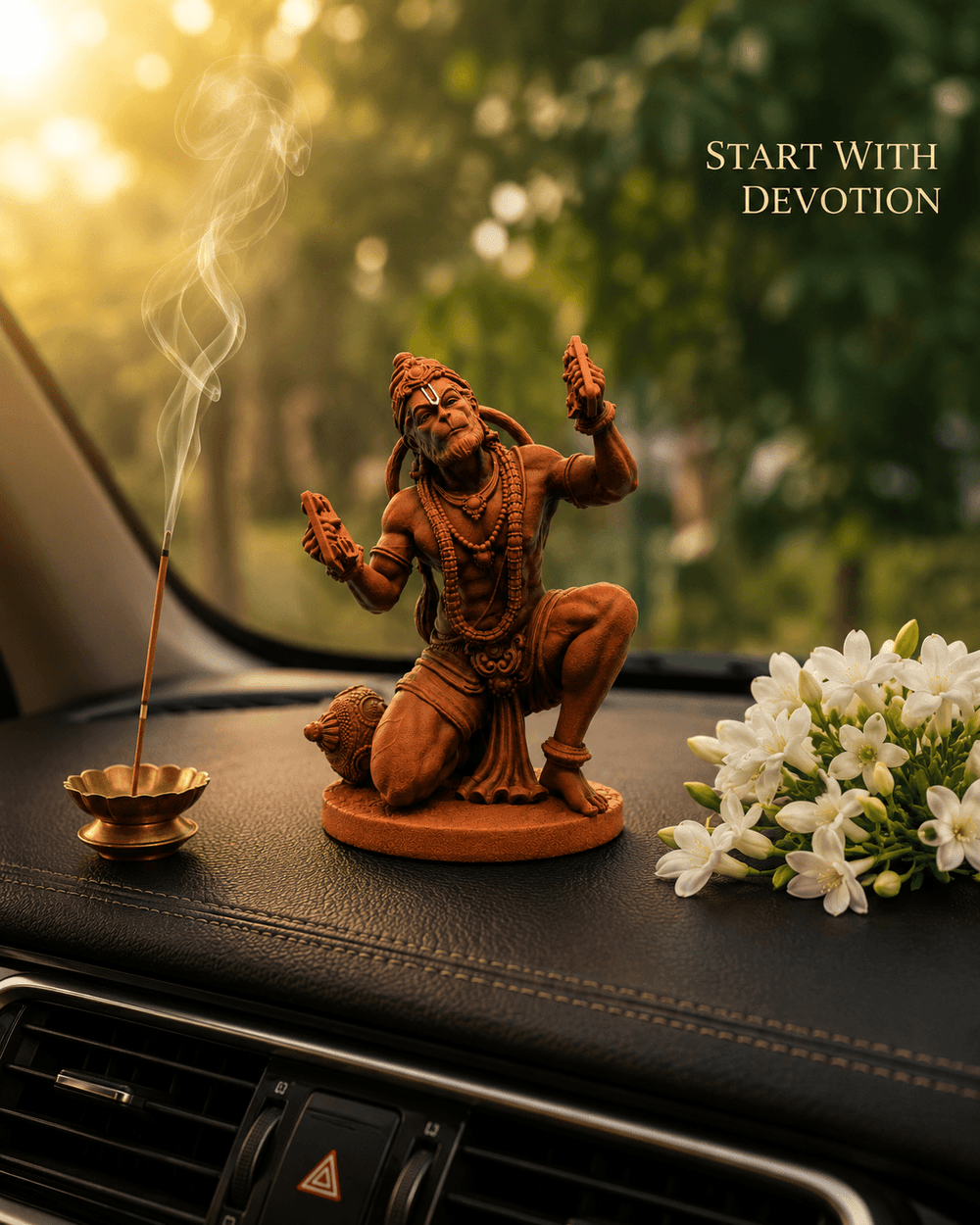 The Ram Rasik Hanuman idol on a dashboard beside incense and white flowers