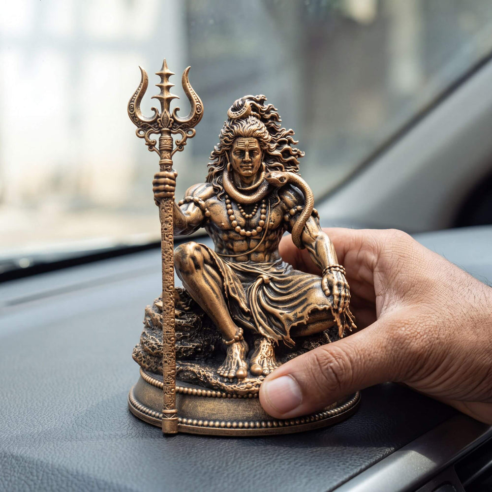 Pressing the idol down onto a car dashboard
