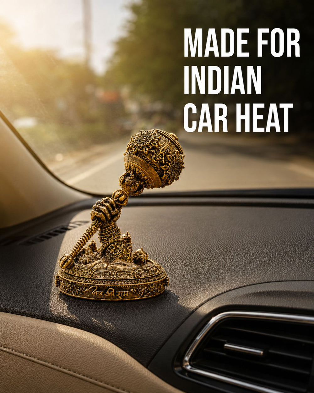 The Hanuman Gada idol on a dashboard in afternoon sun